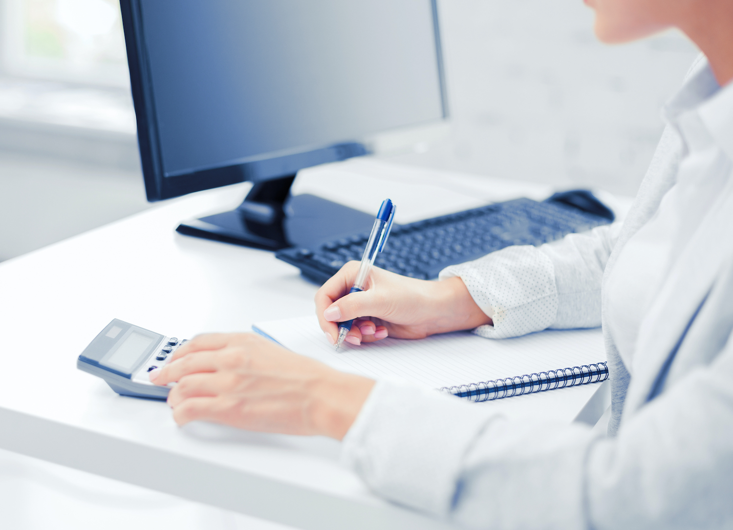 businesswoman with notebook and calculator